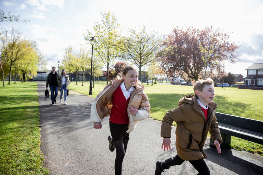 Children playing near family rental homes – housing investment in Scotland